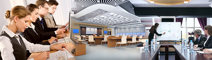 A conference table of colleagues taking notes, a large boardroom fitted with displays, and a presenter working through charts at a screen